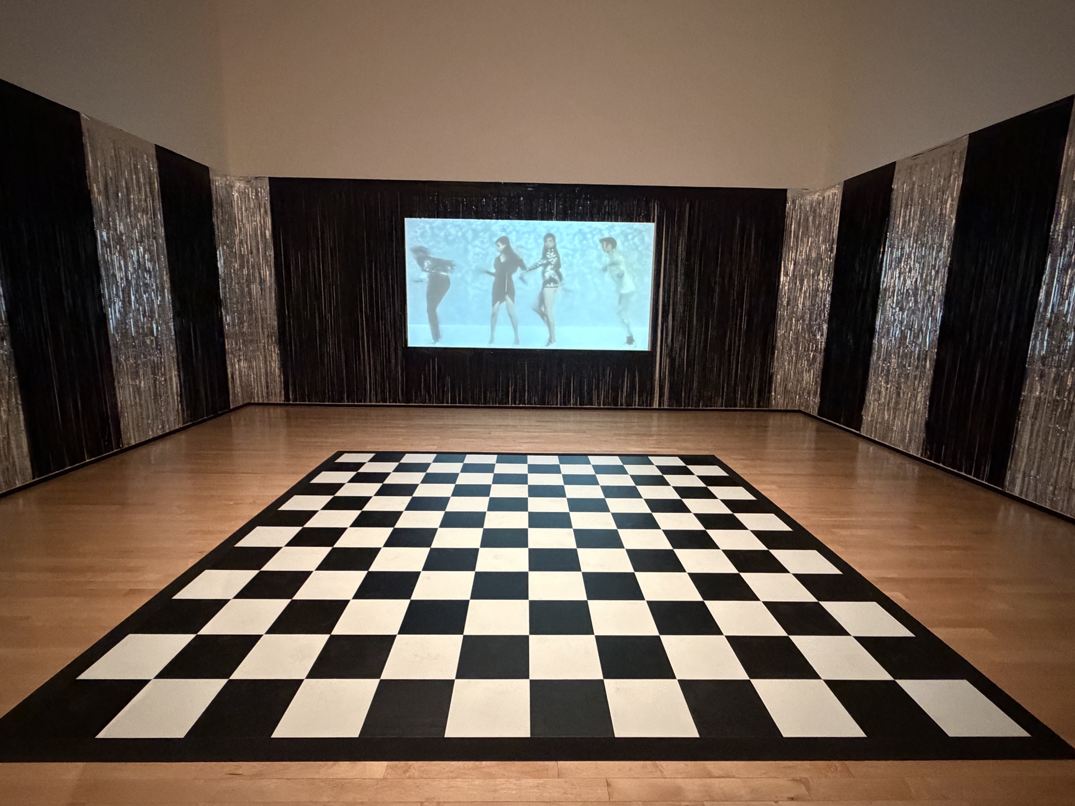 Martine Gutierrez's Clubbing installation with checkerboard dance floor in Visiones Nocturnas